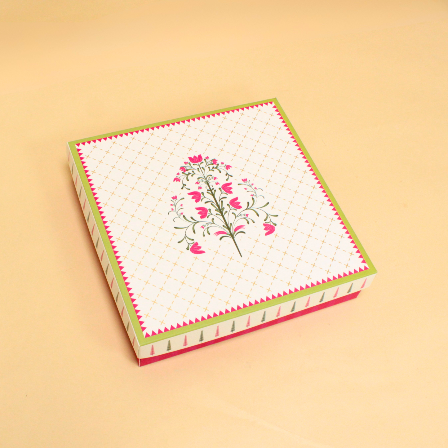 Decorative box with floral design on a beige background