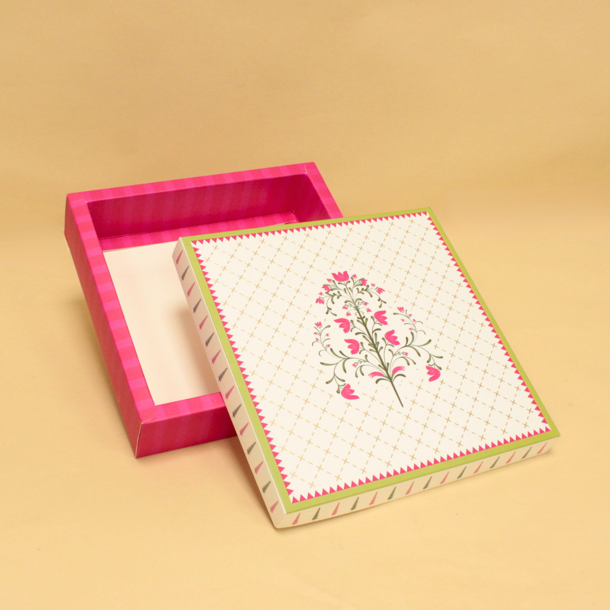 Decorative box with floral design on a beige background